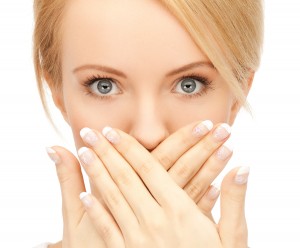 picture of amazed woman with hand over mouth