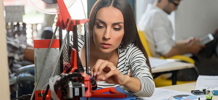Capitalism leaves a woman to create products with a 3D printer.